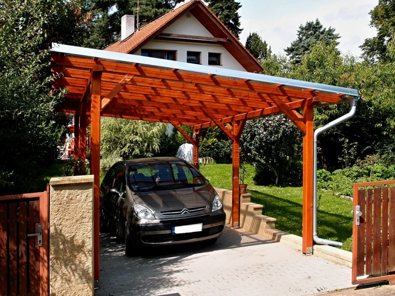 Wooden carport with car
