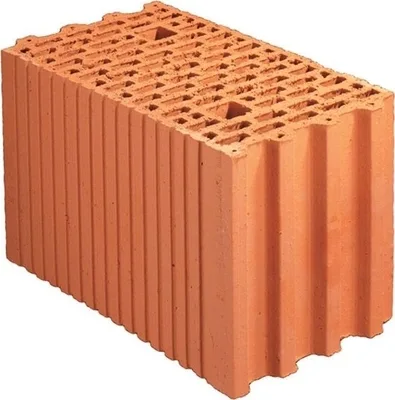 Skládané červené duté cihly pro zdění garáže.