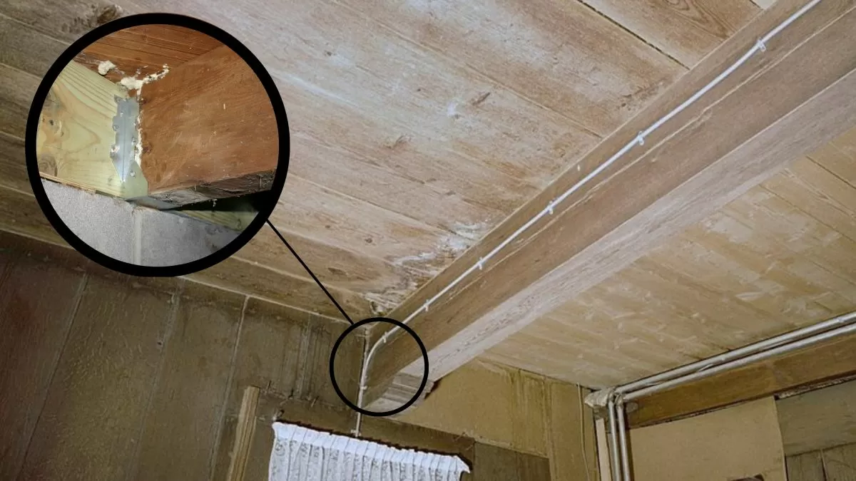 Detail spoje dřevěného trámu s kovovým úchytem pro výpočet rozměrů.