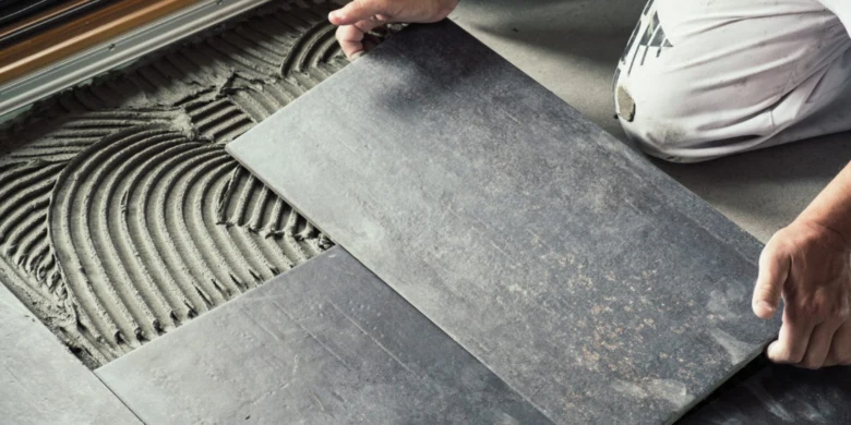 Person laying tile floor