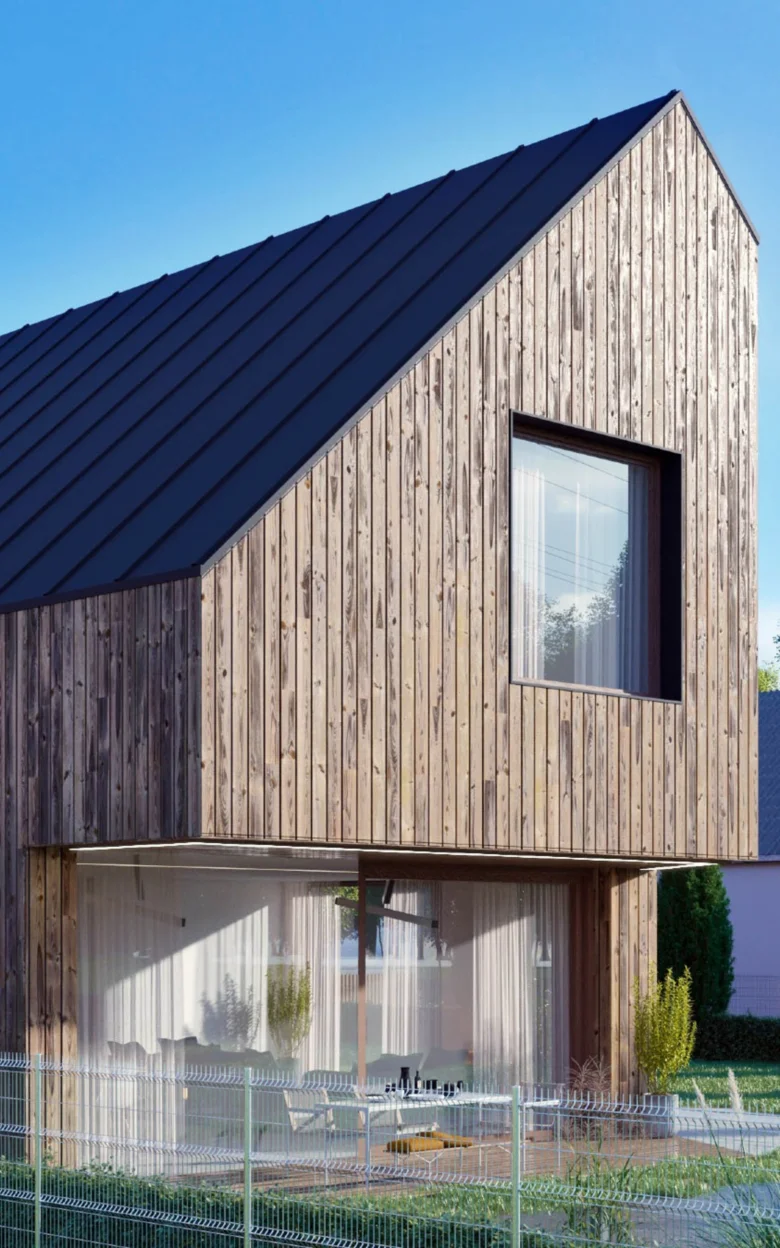 Moderní dřevěný dům ve svahu s terasou a velkým oknem.